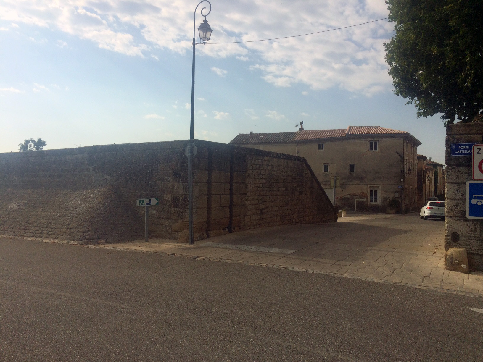 Village circled by old style flood defences from the Rhône.